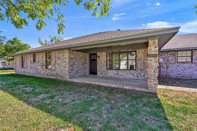 Ranch-style home with a front yard | Image 2