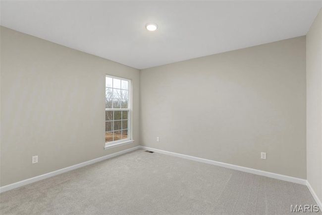 Empty room with baseboards and light carpet | Image 10