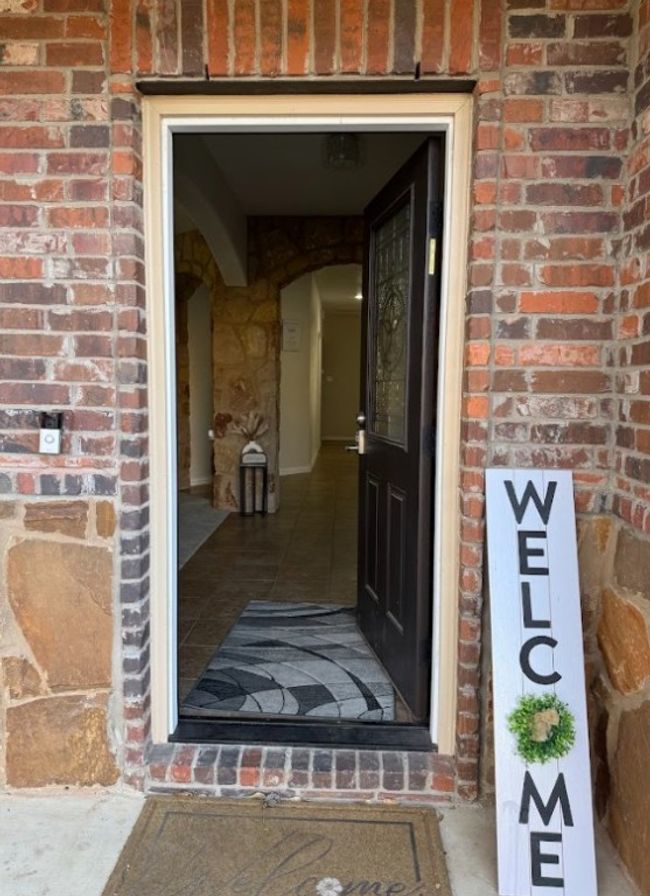 View of front door entrance into beautiful home. | Image 5