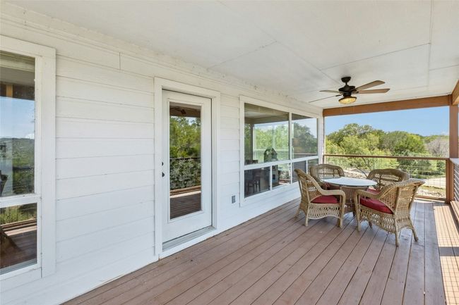 Covered patio with lake views for perfect al fresco dining | Image 16