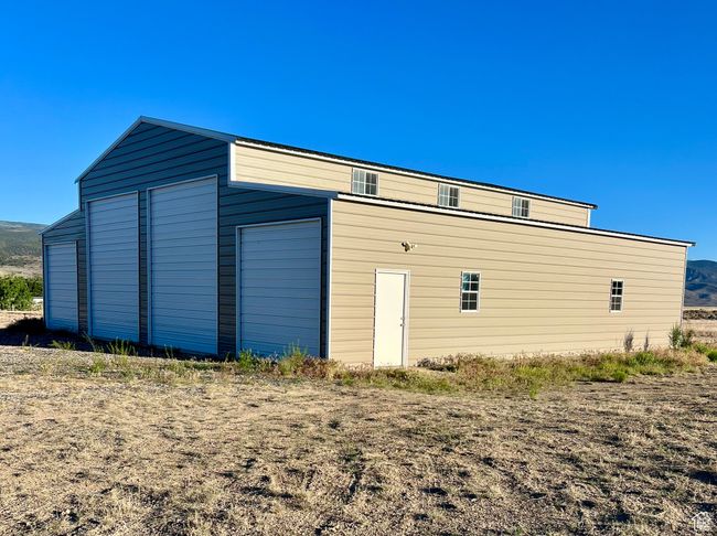 View of side of property with an outbuilding | Image 54