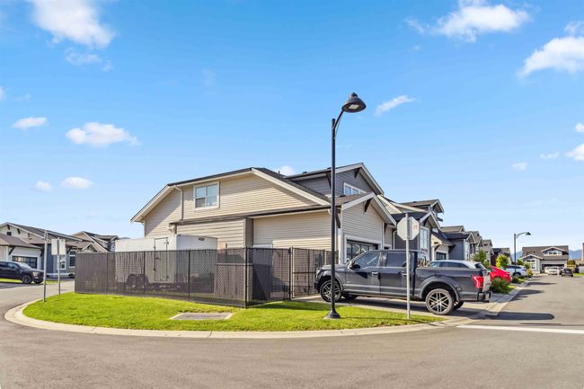 View of front of property with a residential view and fence | Image 4