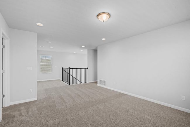 Carpeted spare room with recessed lighting | Image 21