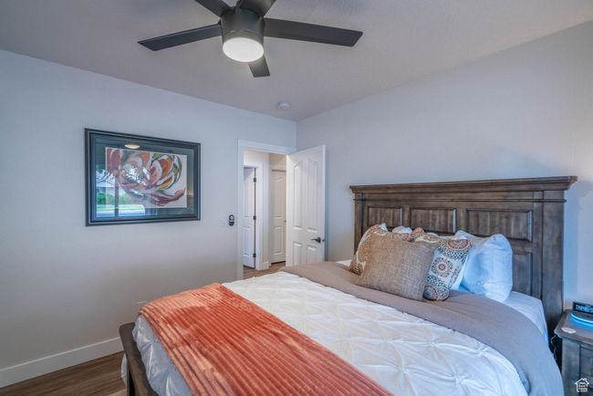 Bedroom with ceiling fan and dark hardwood / wood-style flooring | Image 40