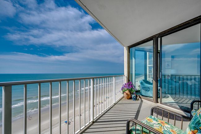Balcony with view of water and beach | Image 18