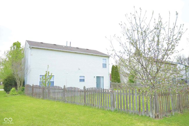 view of side of property featuring fence and a yard | Image 46