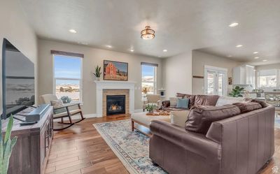 Living room featuring light hardwood / wood-style floors and a fireplace | Image 2