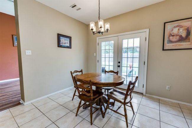 Breakfast nook with chandelier, and light tile | Image 8