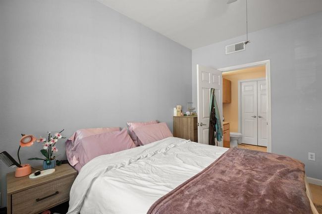 Bedroom featuring baseboards and connected bathroom | Image 15