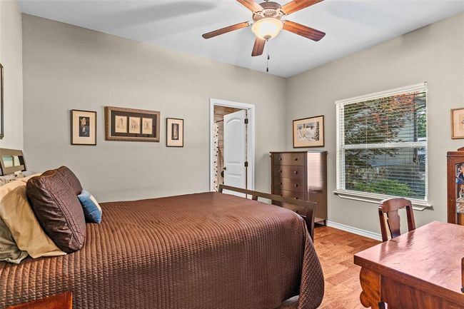 Bedroom featuring ceiling fan and light wood-type flooring | Image 11