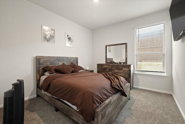 Bedroom with carpet flooring and baseboards | Image 25