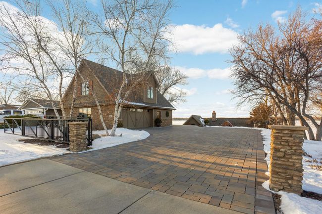 Separate detached garage can fit 4 cars, has a finished space above and the driveway has a mechanical gate | Image 8