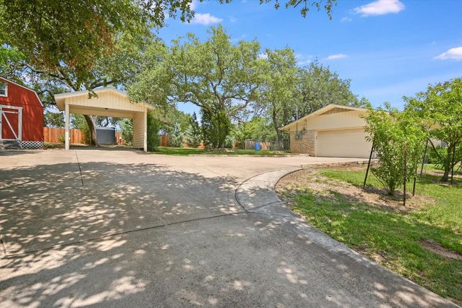 There is the carport, workshop and a storage building. | Image 36