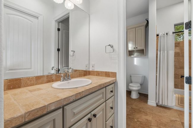 Full bathroom featuring vanity and shower / tub combo with curtain | Image 25