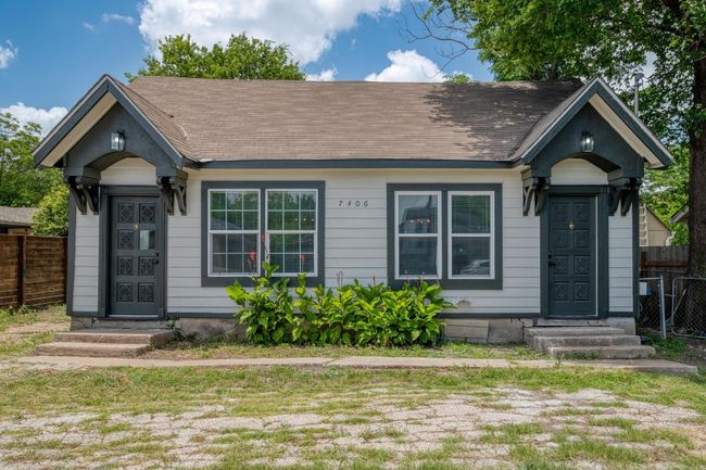 View of front facade with entry steps and roof with shingles | Image 7
