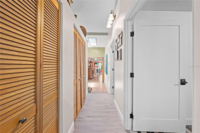 Main Home - This hallway leads to Bedroom #2, the guest bathroom and the Primary Bedroom. | Image 40