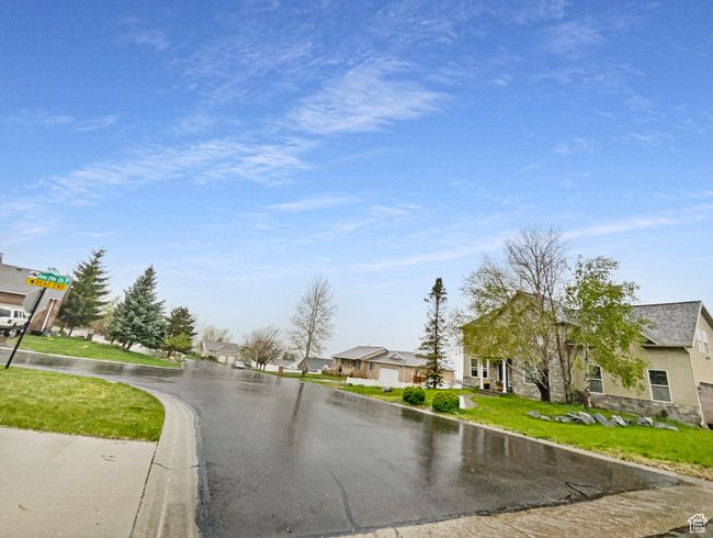 View of road with a residential view and curbs | Image 19
