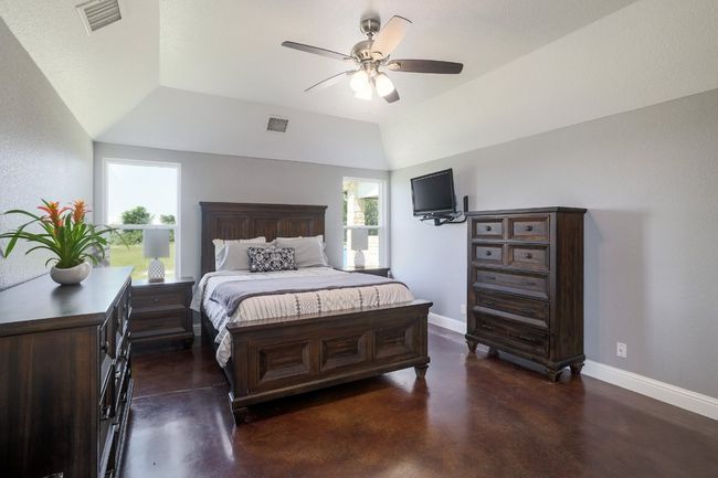 The sleek concrete flooring provides a polished look. | Image 18