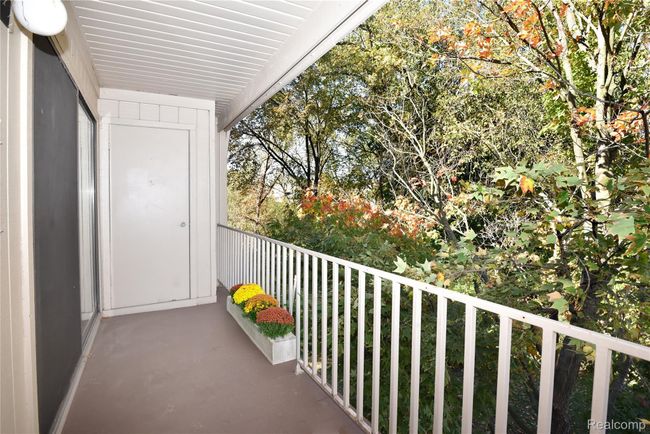 Balcony Overlooks Treed Area | Image 5