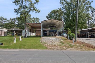 Spacious 18' x 36' RV/Boat parking space, equipped with a 30amp electrical connection, a sewer cleanout hookup, and a freshwater supply. | Image 2