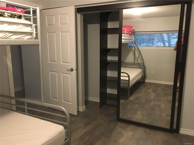 Unfurnished bedroom featuring baseboards and wood finished floors | Image 20