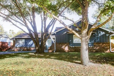 Rear view of property with a yard | Image 2