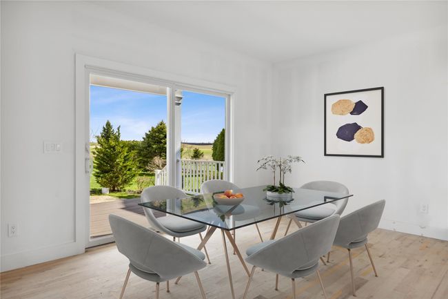 Dining area featuring light wood-style flooring and baseboards | Image 7