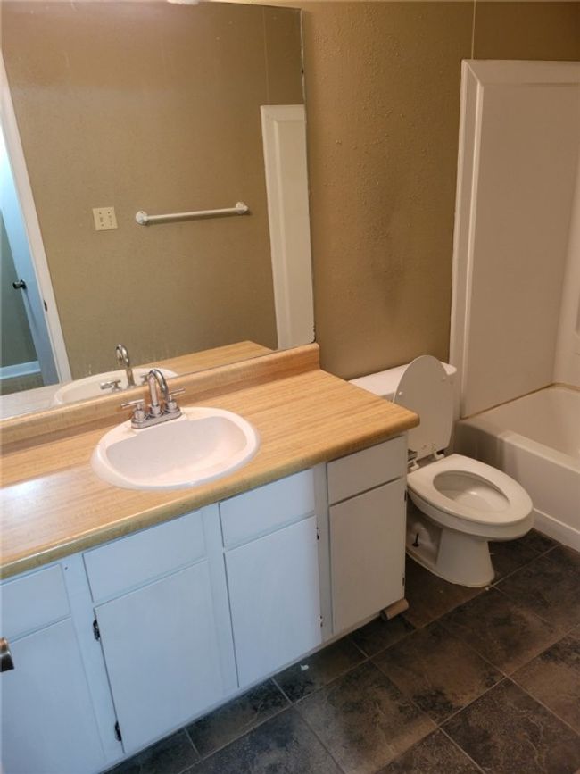 Bathroom featuring vanity and toilet | Image 6