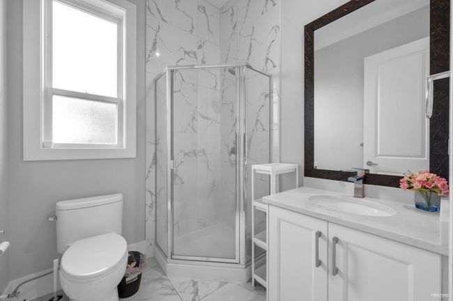 Full bathroom featuring marble finish flooring, vanity, and a marble finish shower | Image 25