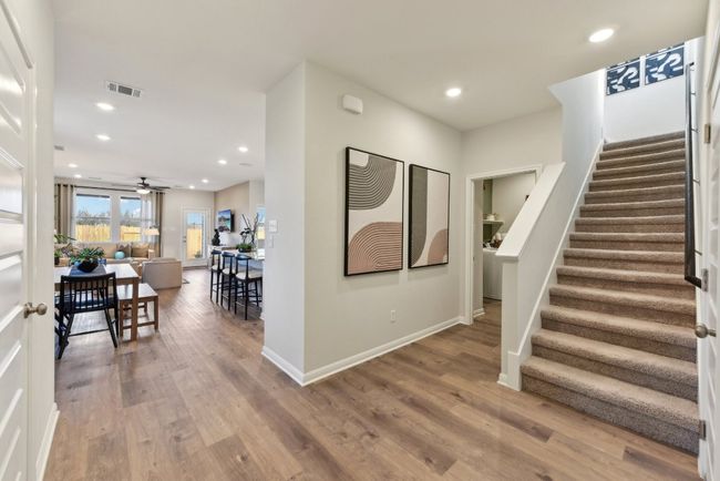 Foyer entrance featuring stairs, wood finished floors, recessed lighting, ceiling fan, and baseboards | Image 15