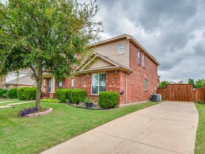 View of front of property with cooling unit and a front yard | Image 1