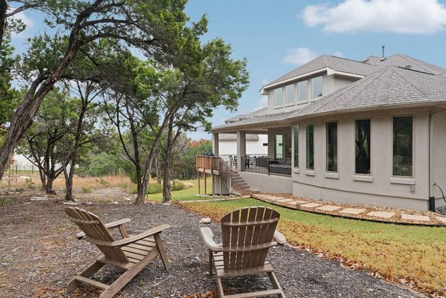 Situated on over half an acre with tall trees, xeriscape features, and gorgeous landscaping. | Image 35