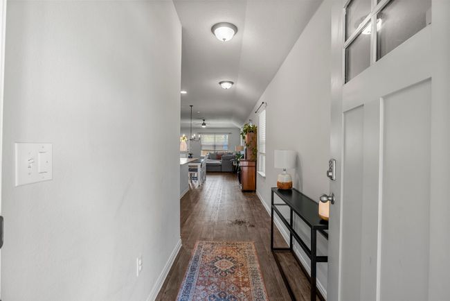 Hall with dark wood finished floors and baseboards | Image 4