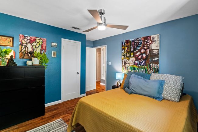 Spacious secondary bedroom at the back corner of the house, looking over the backyard | Image 32