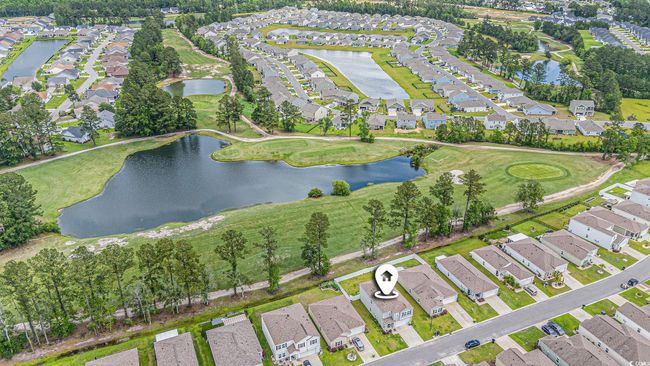 Aerial overview of property's location featuring nearby suburban area and a large body of water | Image 5