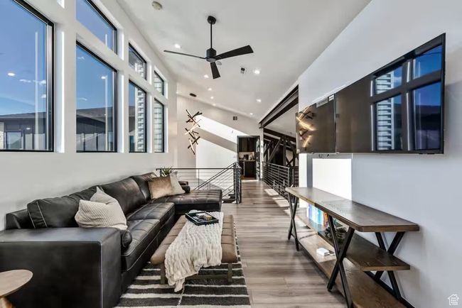 Living area with ceiling fan, wood finished floors, and recessed lighting | Image 28