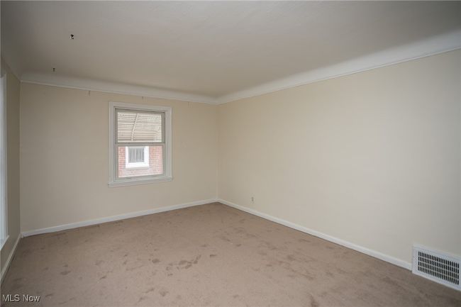 Spare room with carpet flooring and ornamental molding | Image 7