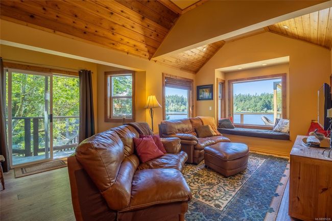 Living room with vaulted wood ceiling | Image 8
