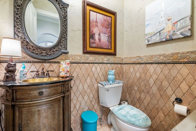 Powder Room with wainscoting, vanity, and tile walls | Image 21