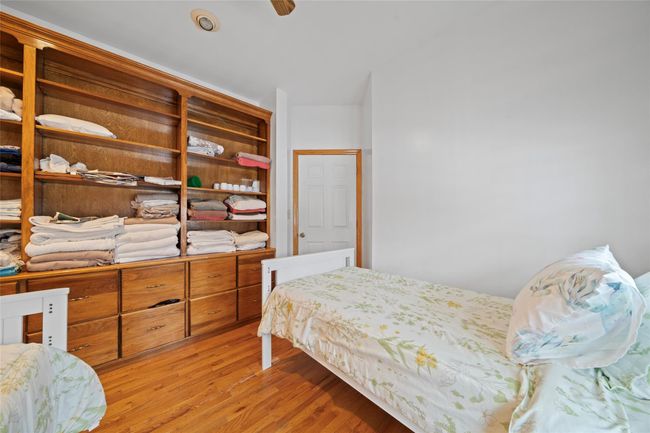 Bedroom featuring light wood-type flooring | Image 39