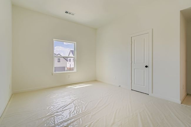 Unfurnished room with baseboards and light colored carpet | Image 23