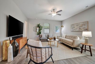 UPGRADED Wide Plank Flooring in Main Living Areas Great Room, Kitchen, Dining + Hall | Image 3