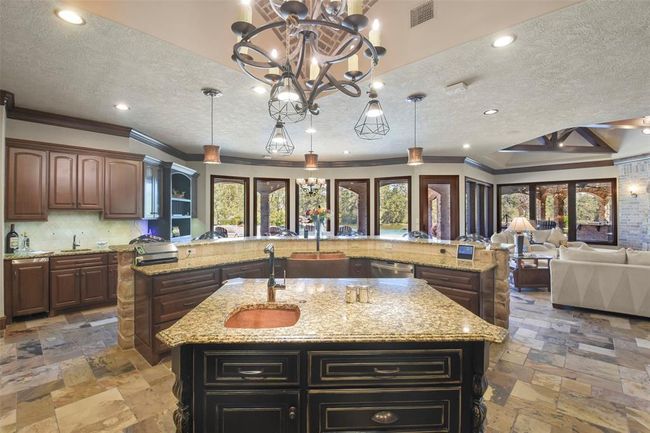 There are granite countertops in the kitchen | Image 16