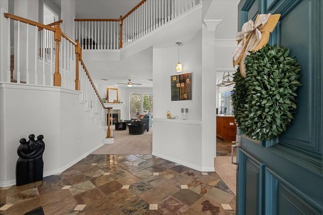 Welcome! As you enter this home you are greeted to a charming entryway leading to a spacious, open living area, offering a seamless flow for entertaining. | Image 4