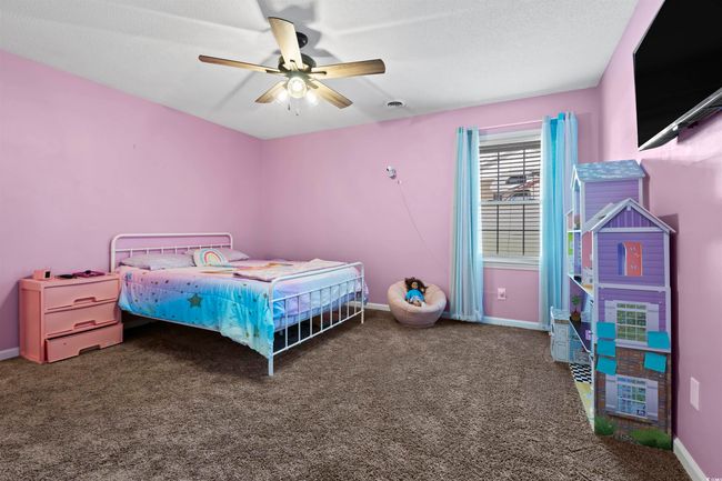 Carpeted bedroom with baseboards and ceiling fan | Image 18