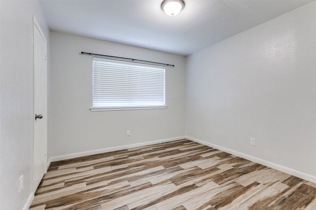 Empty room featuring wood finished floors and baseboards | Image 14