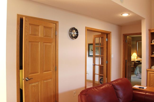Basement door, office and primary suite. | Image 43