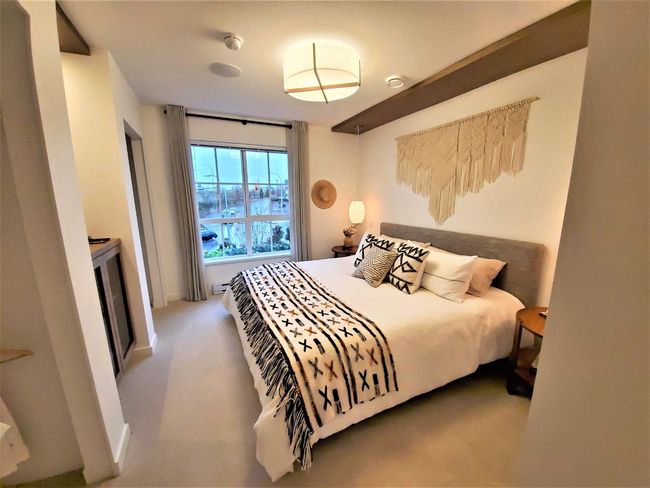 Carpeted bedroom featuring baseboards | Image 6