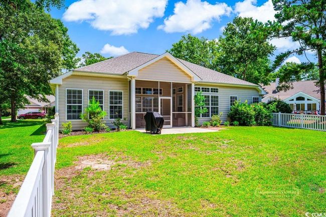 Back of property featuring a sunroom and a shingled roof | Image 36