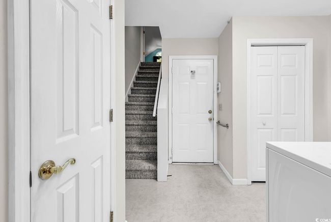 Foyer featuring stairway and light tile patterned floors | Image 25